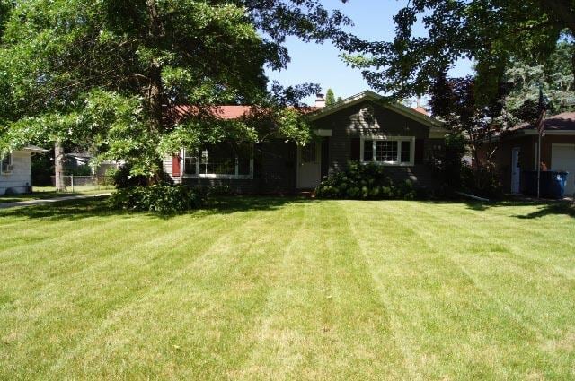 view of front of home with a front yard