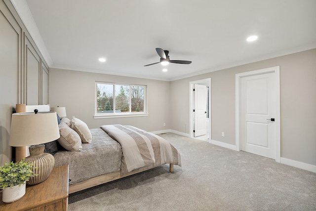 bedroom with ceiling fan, carpet floors, and ornamental molding