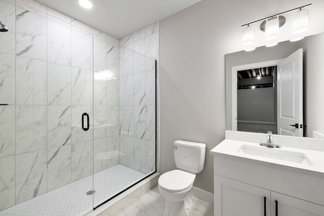 bathroom with an enclosed shower, vanity, and toilet