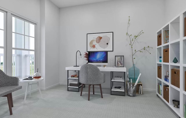 office area featuring light colored carpet