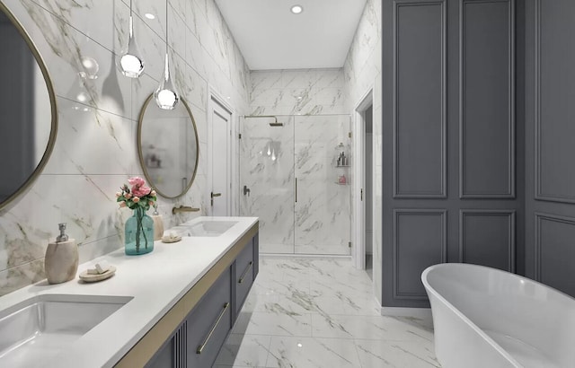 bathroom with vanity, tile walls, and shower with separate bathtub