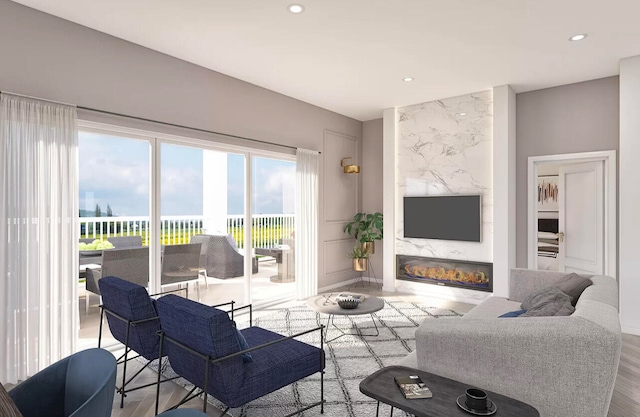 living room with a fireplace and light wood-type flooring