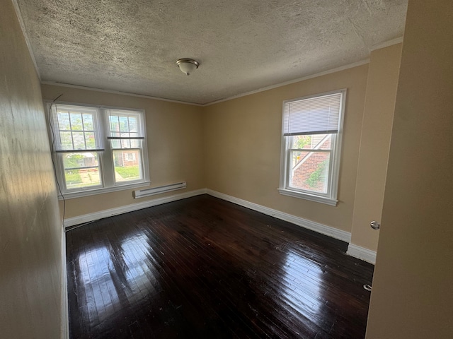 unfurnished room with a healthy amount of sunlight, dark hardwood / wood-style flooring, and baseboard heating