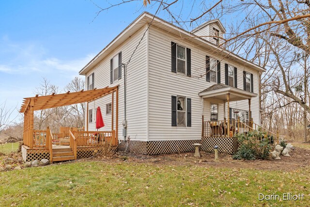 exterior space with a deck and a yard