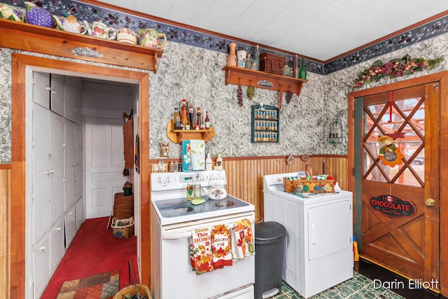 laundry room featuring wallpapered walls, laundry area, washer / clothes dryer, and a wainscoted wall