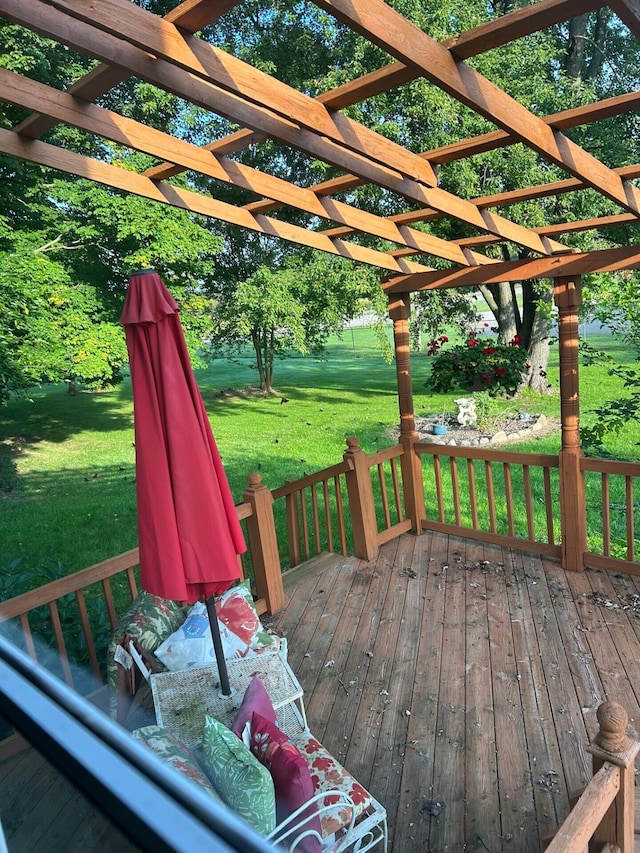 deck with a yard and a pergola