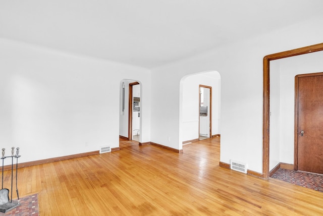 spare room featuring hardwood / wood-style flooring