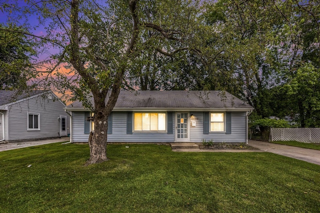 ranch-style house with a lawn