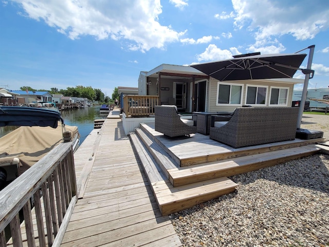 831 S Main St, Au Gres, MI 48703 - wooden deck featuring a water view and a boat dock
