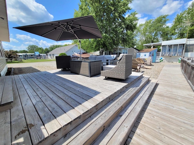 831 S Main St, Au Gres, MI 48703 - wooden deck with outdoor lounge area