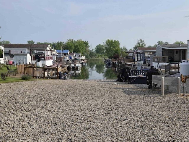 831 S Main St, Au Gres, MI 48703 - dock with a water view and a residential view