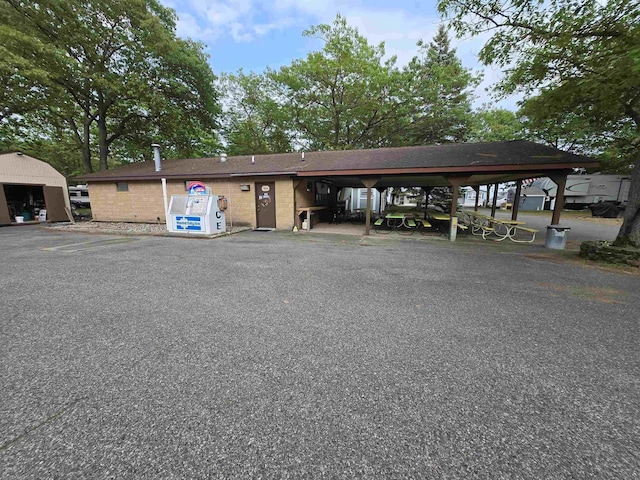 831 S Main St, Au Gres, MI 48703 - view of parking with a carport