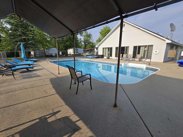 831 S Main St, Au Gres, MI 48703 - view of swimming pool featuring a patio area
