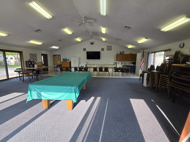 831 S Main St, Au Gres, MI 48703 - game room with dark colored carpet, ceiling fan, vaulted ceiling, a textured ceiling, and billiards table
