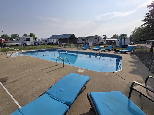 831 S Main St, Au Gres, MI 48703 - view of swimming pool with a patio area