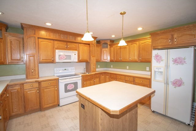 kitchen featuring pendant lighting, sink, white appliances, and a kitchen island