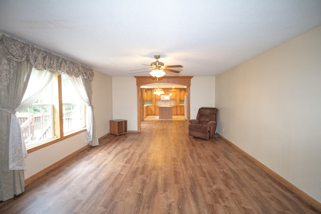 unfurnished room with hardwood / wood-style flooring and ceiling fan