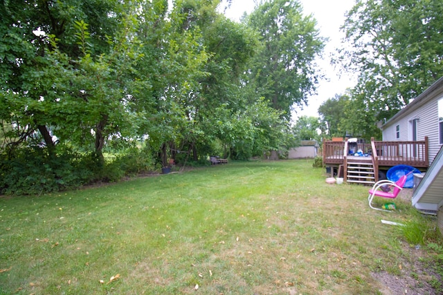 view of yard featuring a wooden deck