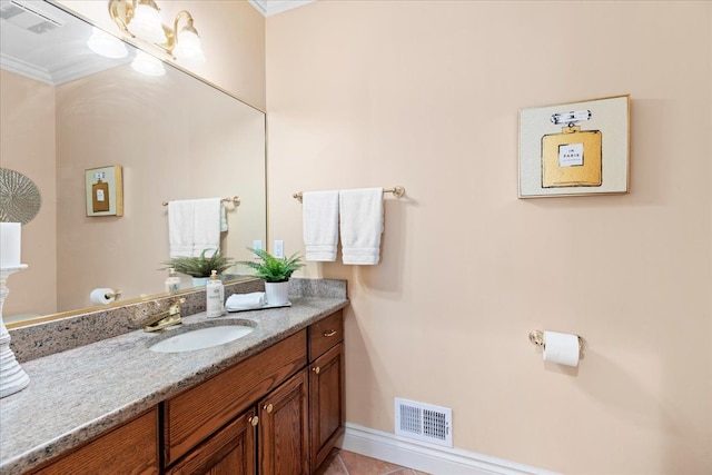 bathroom with tile patterned floors, vanity, and crown molding