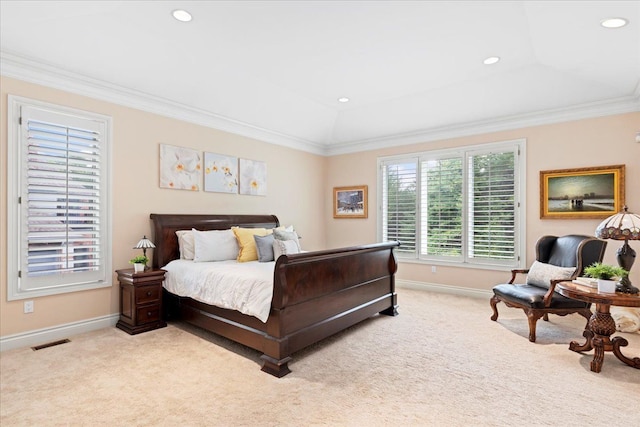 carpeted bedroom with lofted ceiling, a raised ceiling, and ornamental molding