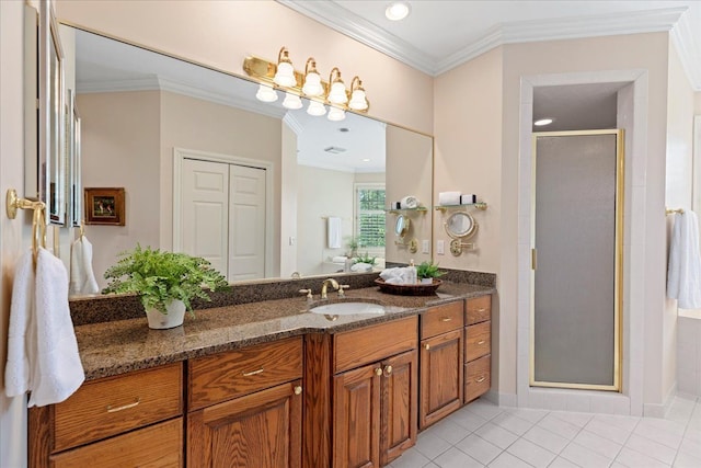 bathroom featuring crown molding, tile patterned flooring, vanity, and an enclosed shower