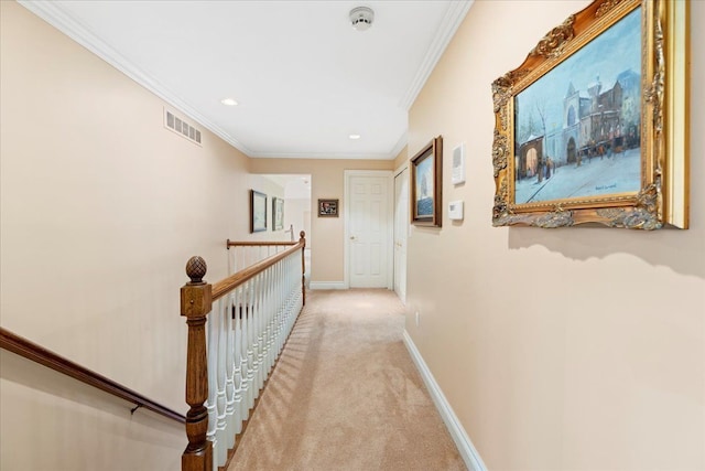 corridor featuring crown molding and light carpet