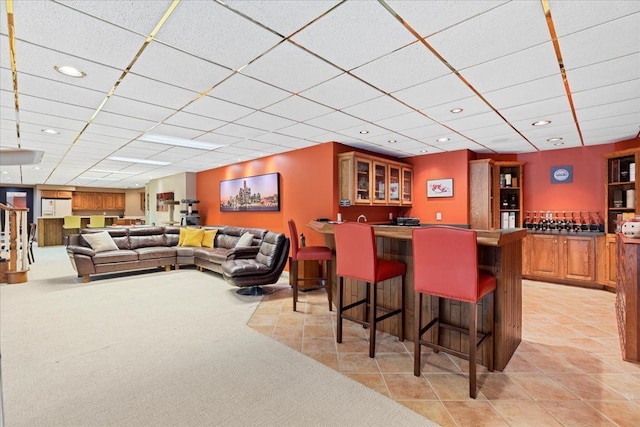 bar featuring a drop ceiling