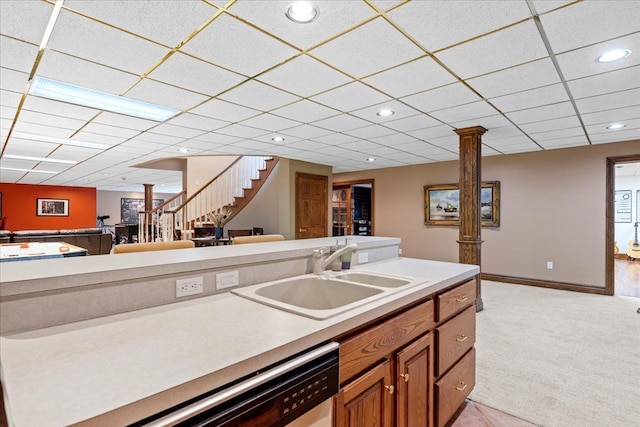 kitchen featuring light carpet, a paneled ceiling, dishwasher, and sink