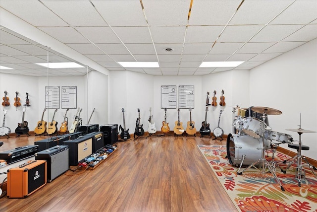 miscellaneous room with hardwood / wood-style flooring and a paneled ceiling