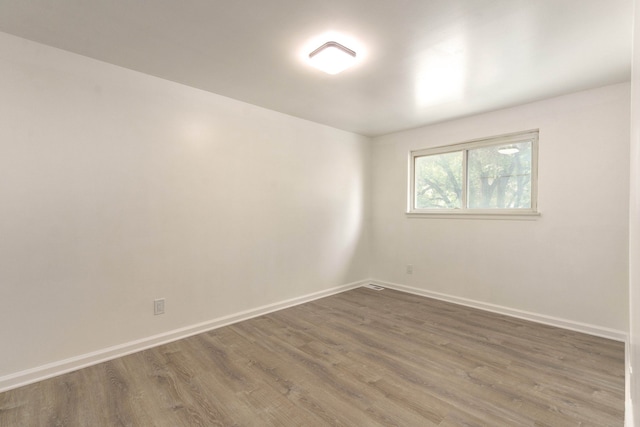 spare room featuring dark hardwood / wood-style floors