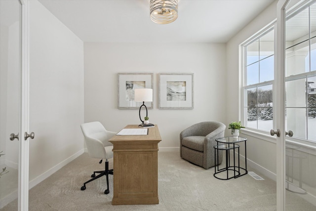 home office featuring french doors, light colored carpet, visible vents, and baseboards