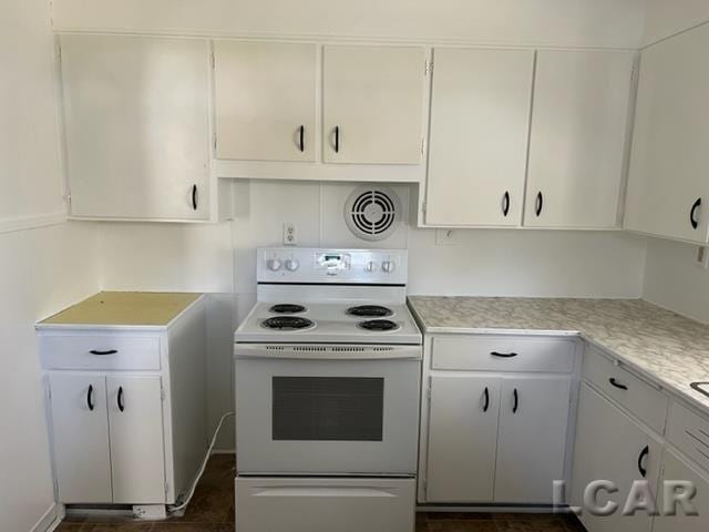 kitchen with white cabinetry and white range with electric cooktop