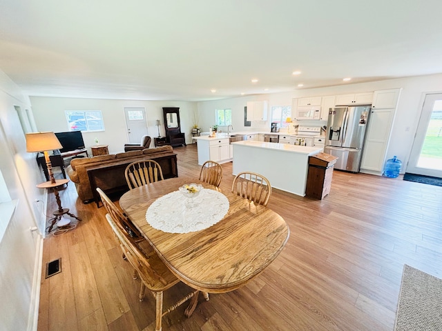 dining room with light hardwood / wood-style floors