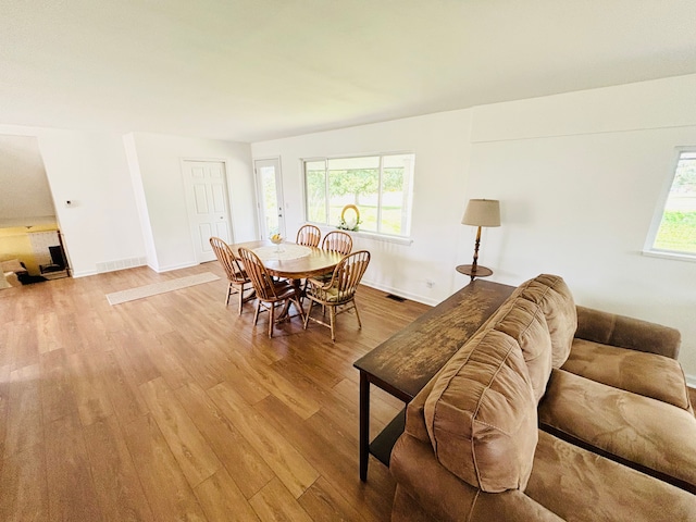 58191 8 Mile Rd, Northville, MI 48167 - dining space with light wood-style flooring and baseboards