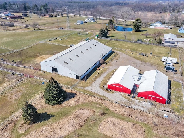 birds eye view of property with a rural view