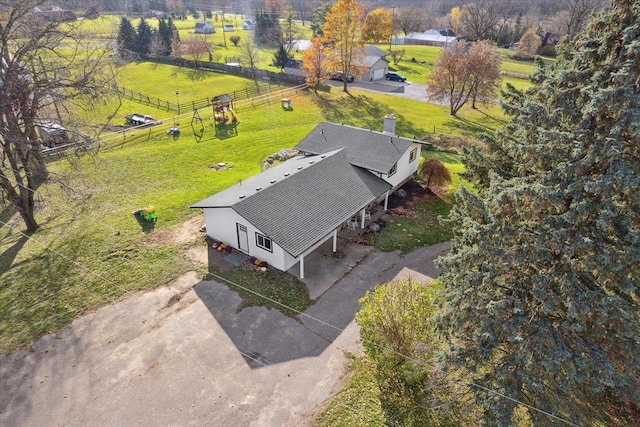 birds eye view of property with a rural view