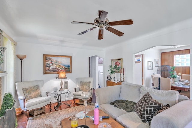 living room featuring hardwood / wood-style flooring and ceiling fan