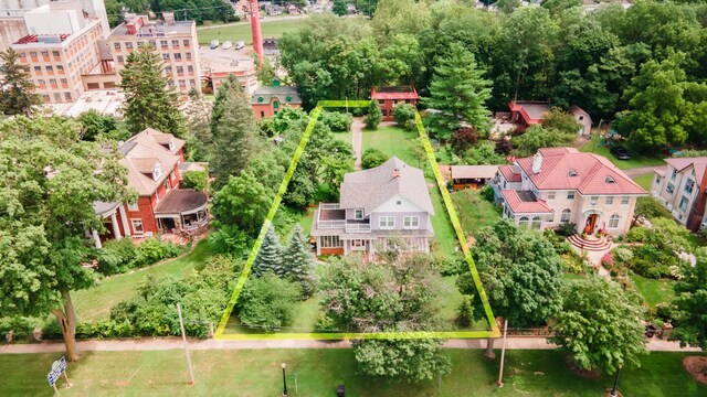 15 S Broad St, Hillsdale, MI 49242 - aerial view of property's location with property boundaries highlighted and a tree filled landscape