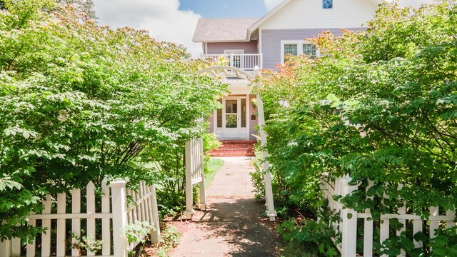 15 S Broad St, Hillsdale, MI 49242 - view of front of home with a balcony and roof with shingles