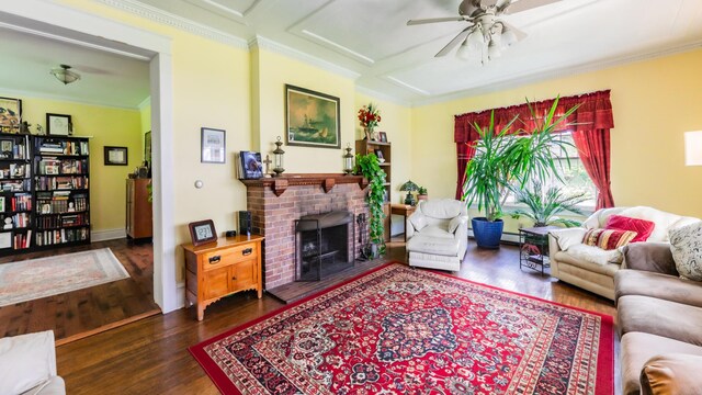15 S Broad St, Hillsdale, MI 49242 - living room featuring a ceiling fan, wood finished floors, crown molding, a baseboard heating unit, and a brick fireplace