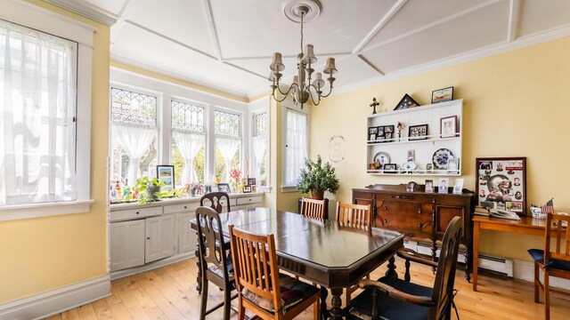 15 S Broad St, Hillsdale, MI 49242 - dining room with a chandelier, light wood-style floors, ornamental molding, and a baseboard radiator