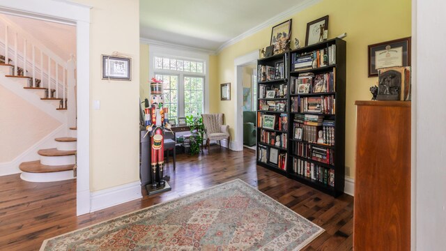 15 S Broad St, Hillsdale, MI 49242 - living area featuring crown molding, wood finished floors, stairs, and baseboards
