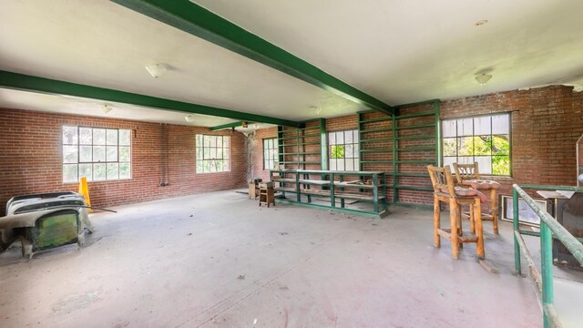 15 S Broad St, Hillsdale, MI 49242 - misc room with brick wall and beamed ceiling