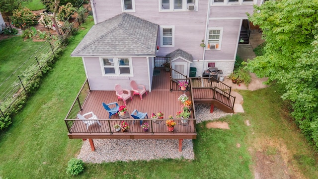 back of house with a lawn and a wooden deck