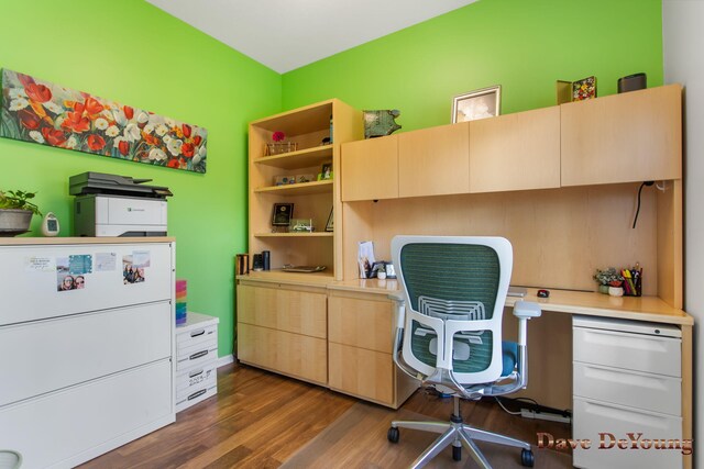 home office with dark wood-type flooring