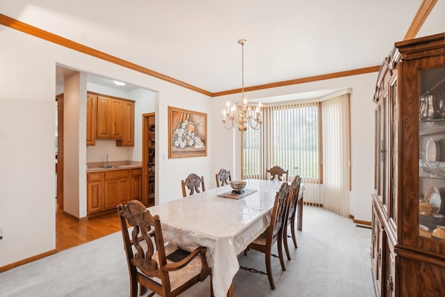 dining space featuring baseboards, a notable chandelier, and light carpet