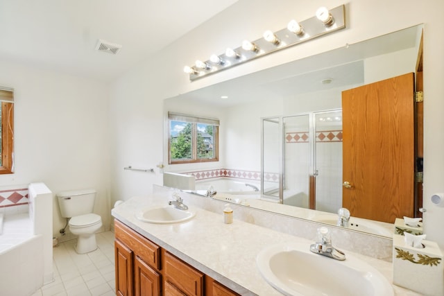 full bathroom featuring tile patterned floors, visible vents, a sink, and a garden tub