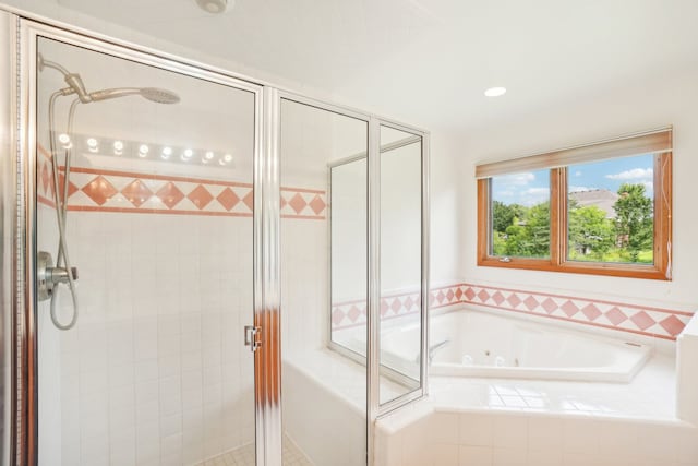 bathroom with a whirlpool tub and a stall shower