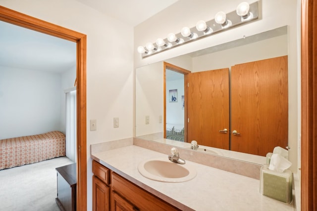 ensuite bathroom featuring vanity and ensuite bathroom