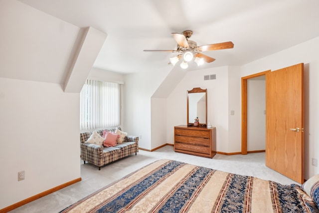 bedroom featuring baseboards, light carpet, and visible vents